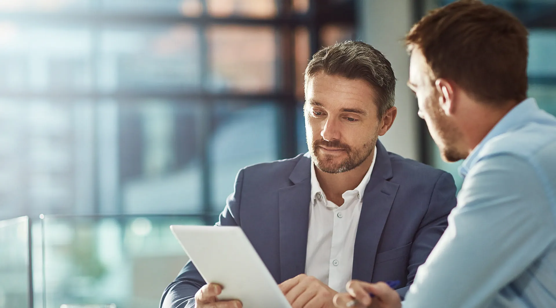 two-professionals-meeting-with-tablet
