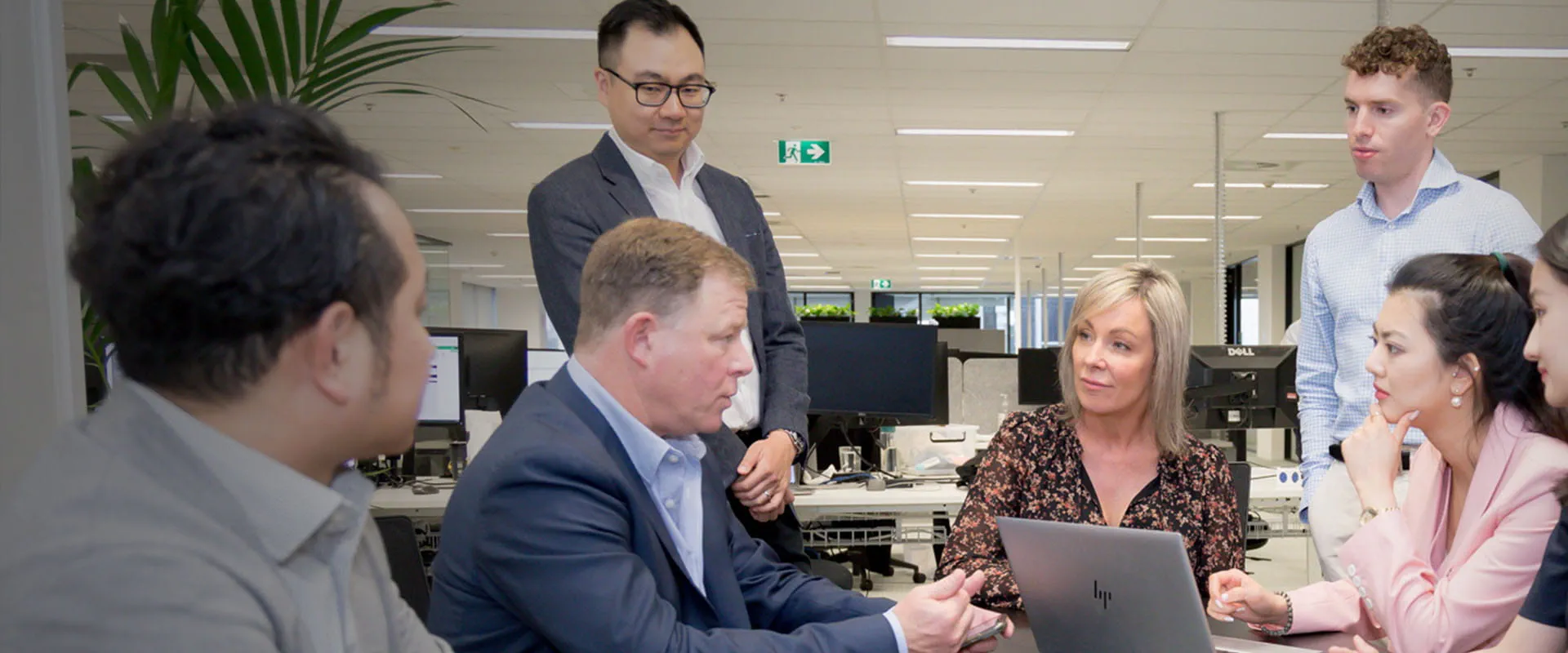 A group of colleagues in discussion. A group of colleagues in discussion.