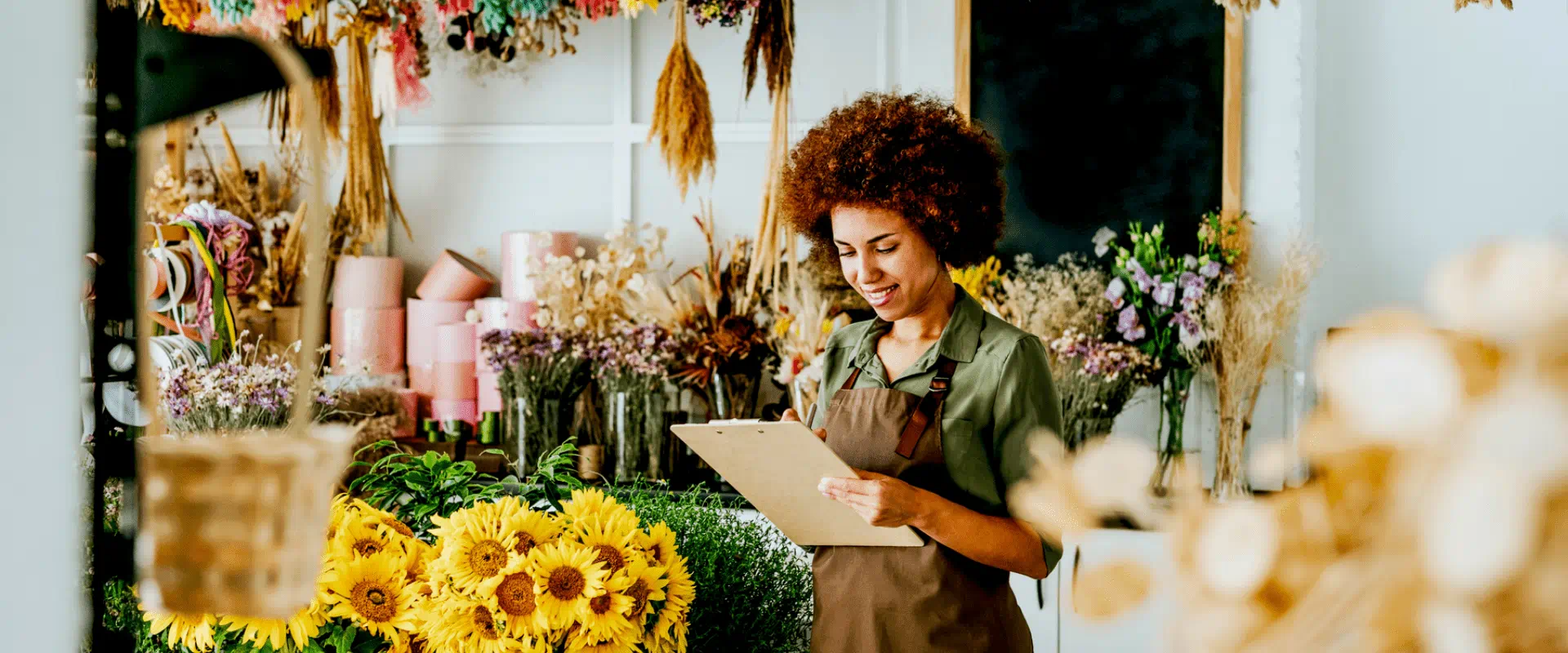 Florist arranging flowers in shop Florist arranging flowers in shop