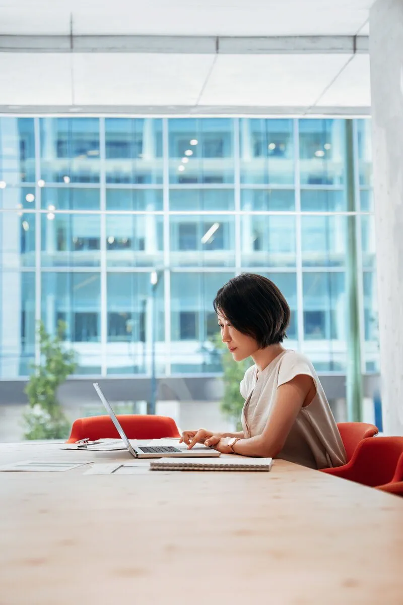 Business executive working at a desk in a modern office Business executive working at a desk in a modern office