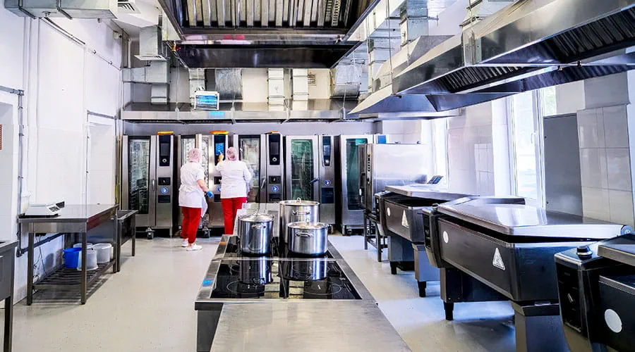Clean commercial kitchen ready for food preparation and service Clean commercial kitchen ready for food preparation and service