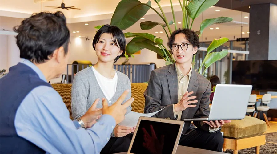 Business team discussing a project with a client Business team discussing a project with a client