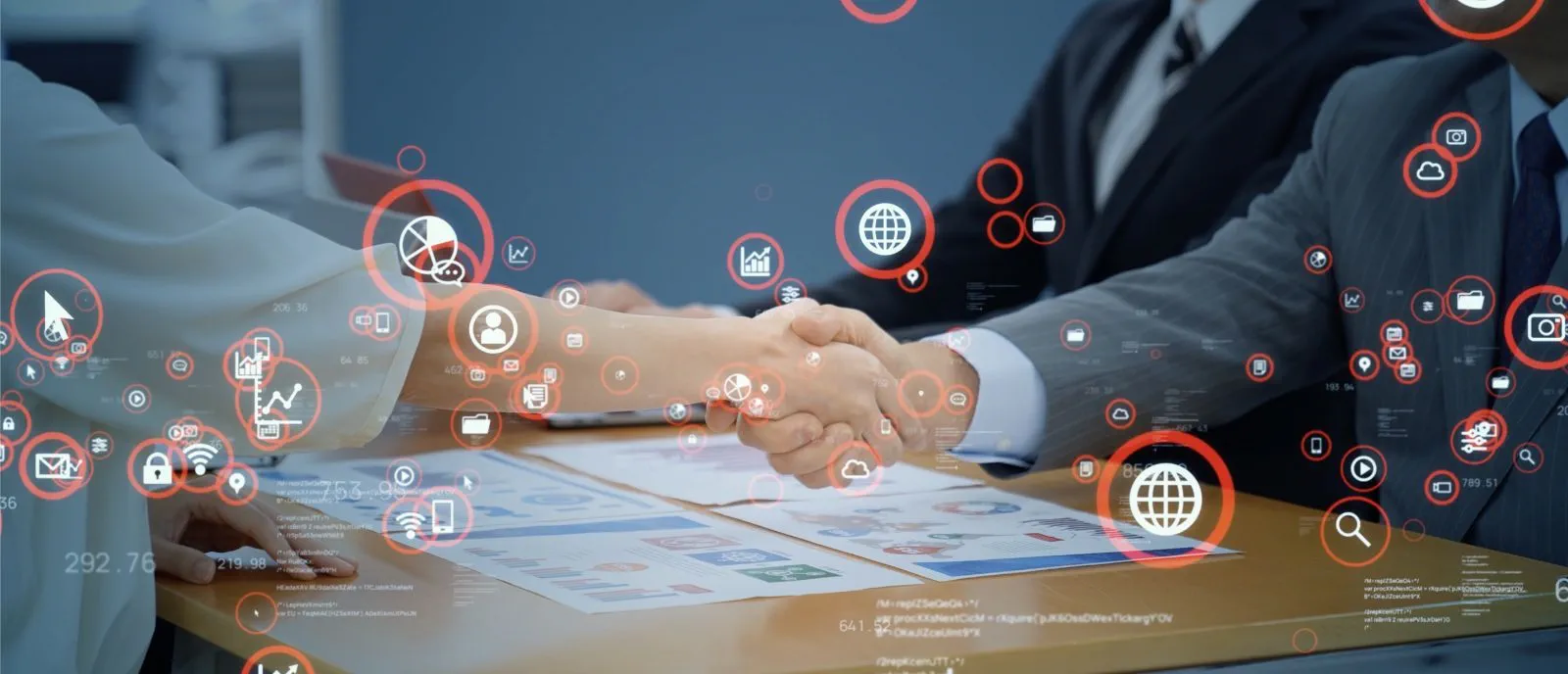 Business handshake over a table with charts and documents, surrounded by digital icons representing technology and data, symbolizing a tech-driven business deal Business handshake over a table with charts and documents, surrounded by digital icons representing technology and data, symbolizing a tech-driven business deal