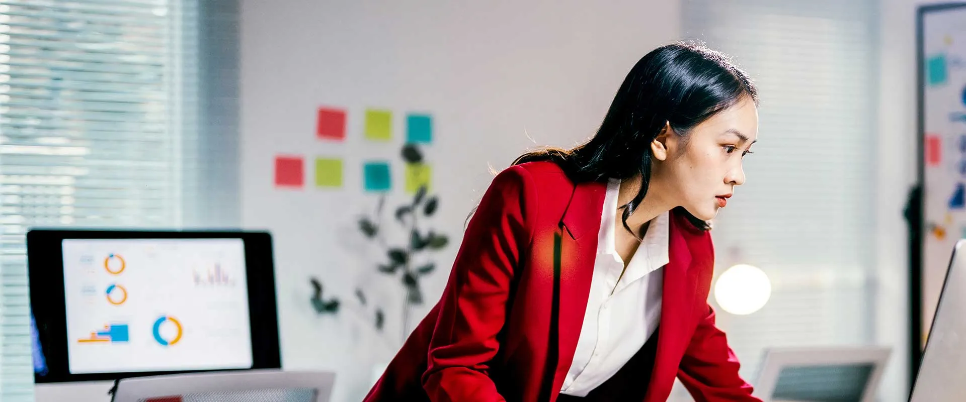 Smiling professional in corporate finance environment Smiling professional in corporate finance environment