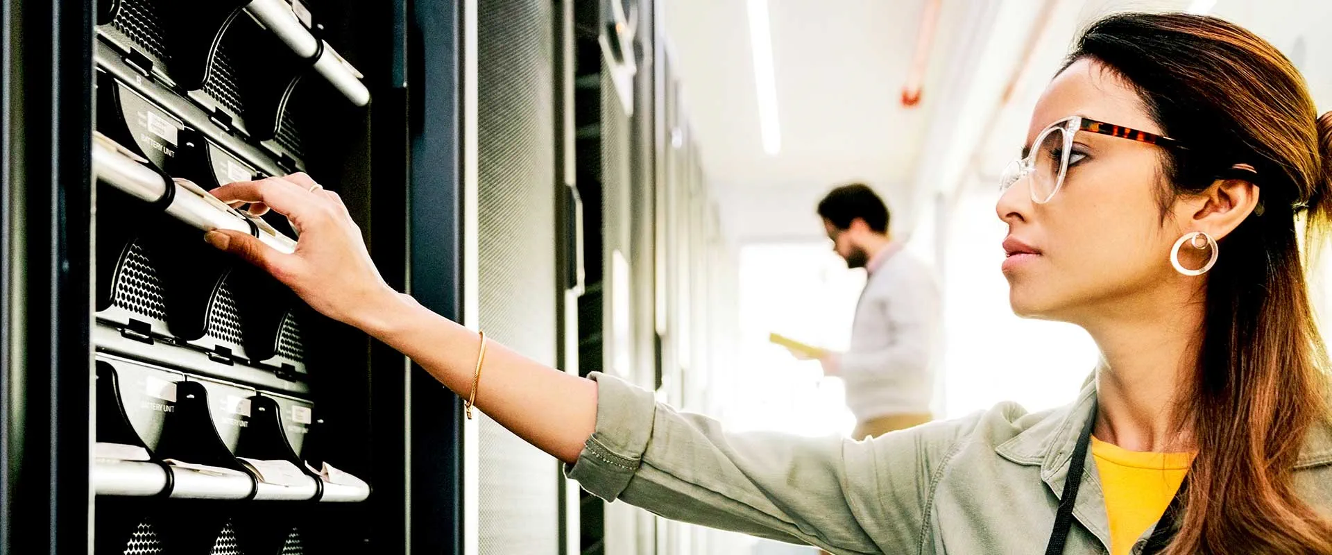 IT professional managing servers in data centre IT professional managing servers in data centre