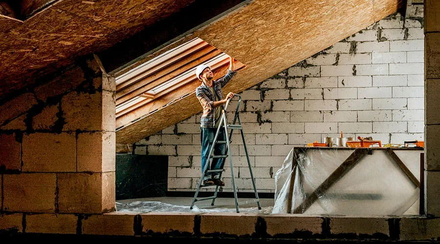 Carpenter working with wood materials on site Carpenter working with wood materials on site