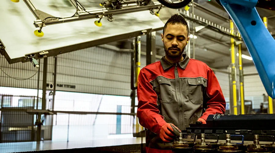 Technician working on industrial equipment Technician working on industrial equipment