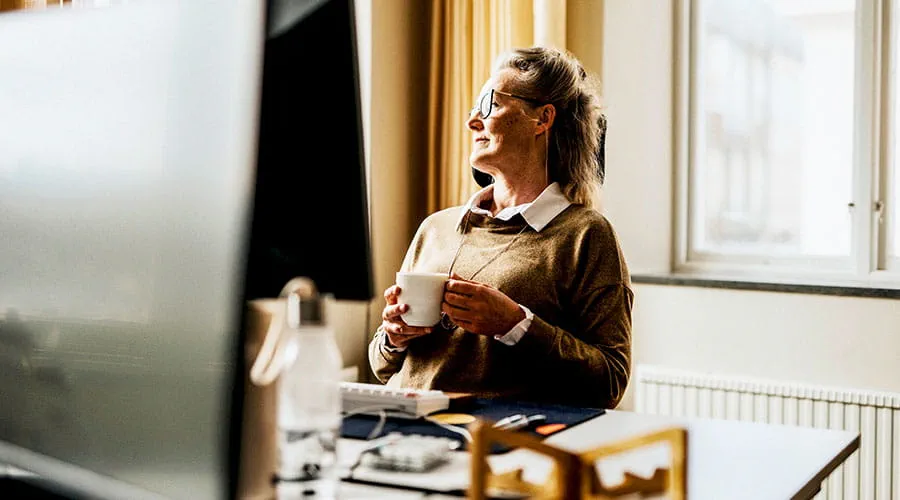 Person working on laptop at desk