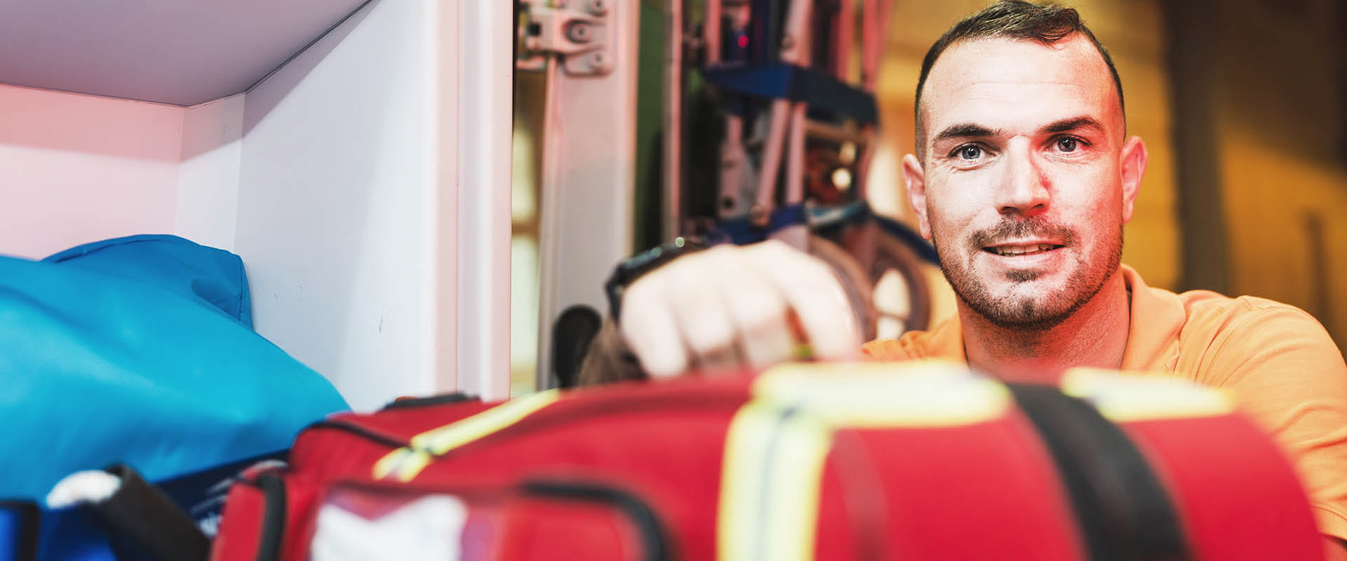 Worker handling equipment in indoor setting Worker handling equipment in indoor setting