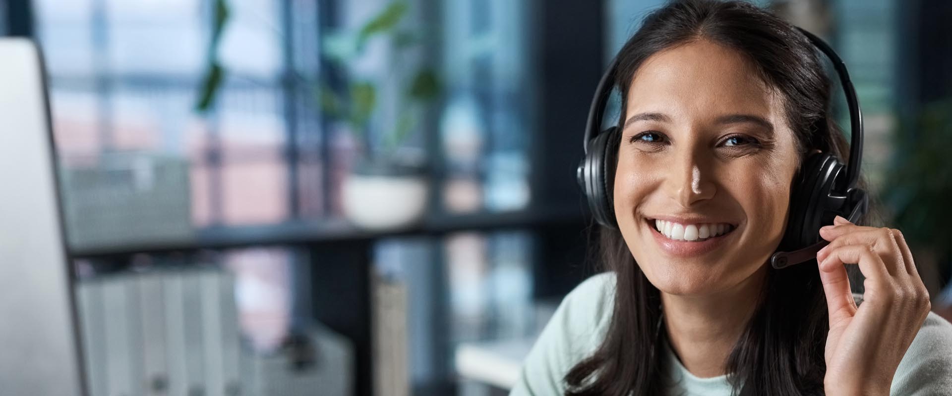 Friendly female customer  service representative on  a headset