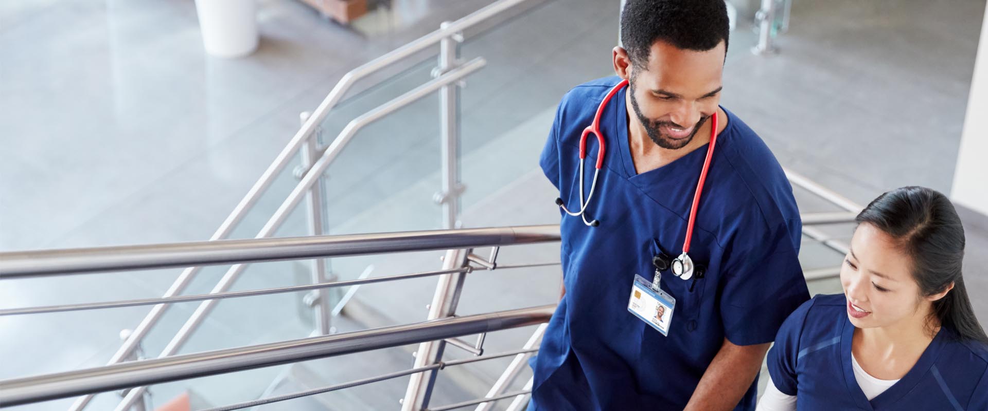 Healthcare workers discussing in a hospital corridor