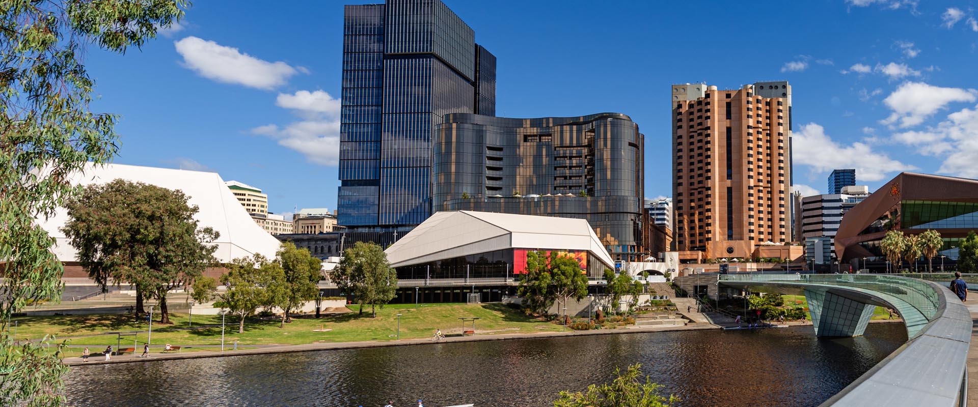 Scenic view of Adelaide River with city skyline in  the background