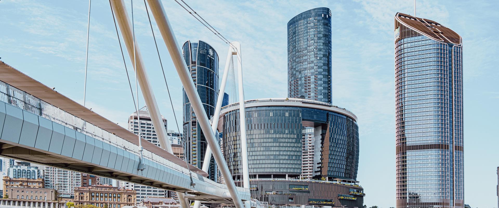 Modern bridge in Brisbane city with high-rise  buildings in the background