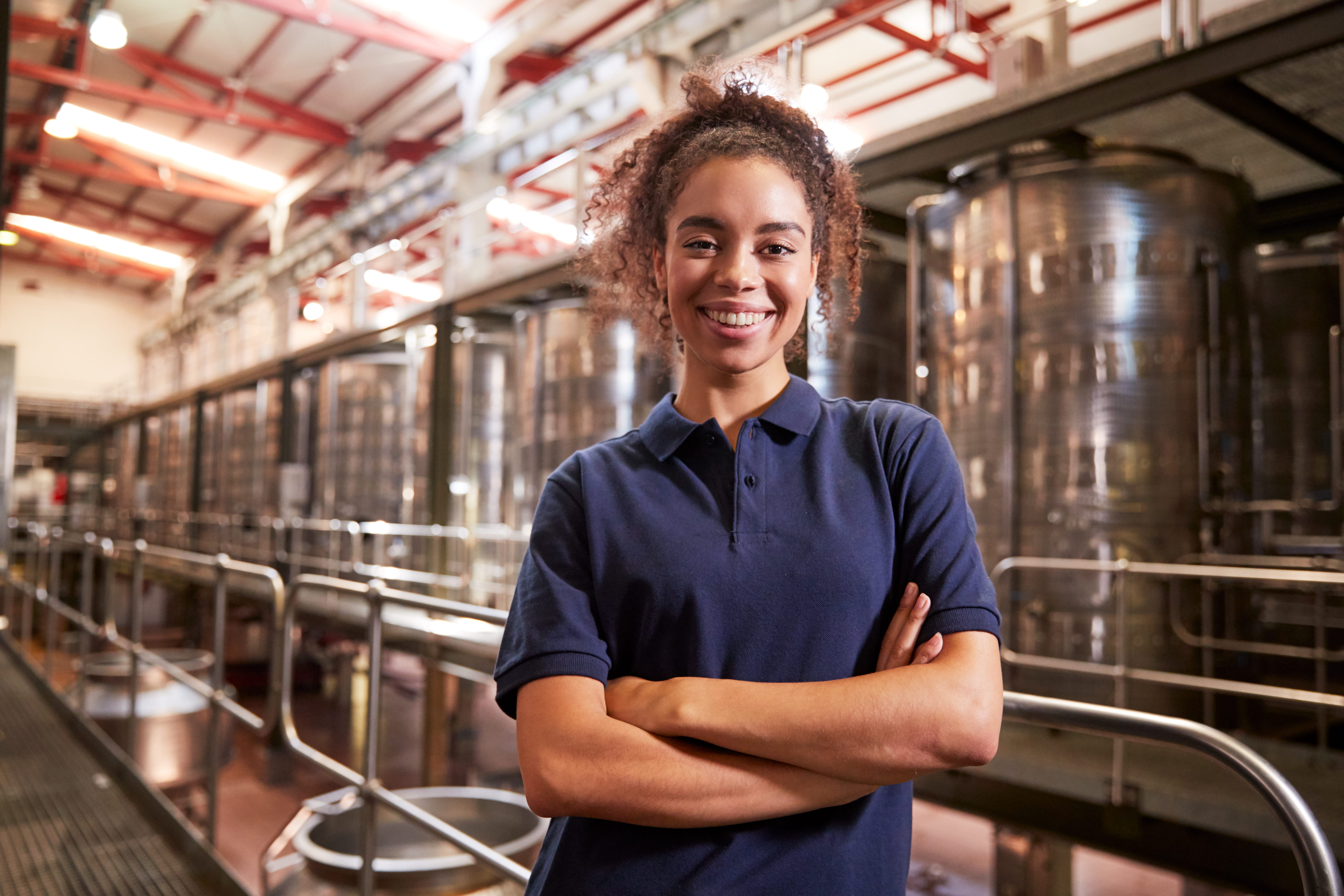 Adecco associate is proud of her work at a client's manufacturing facility.