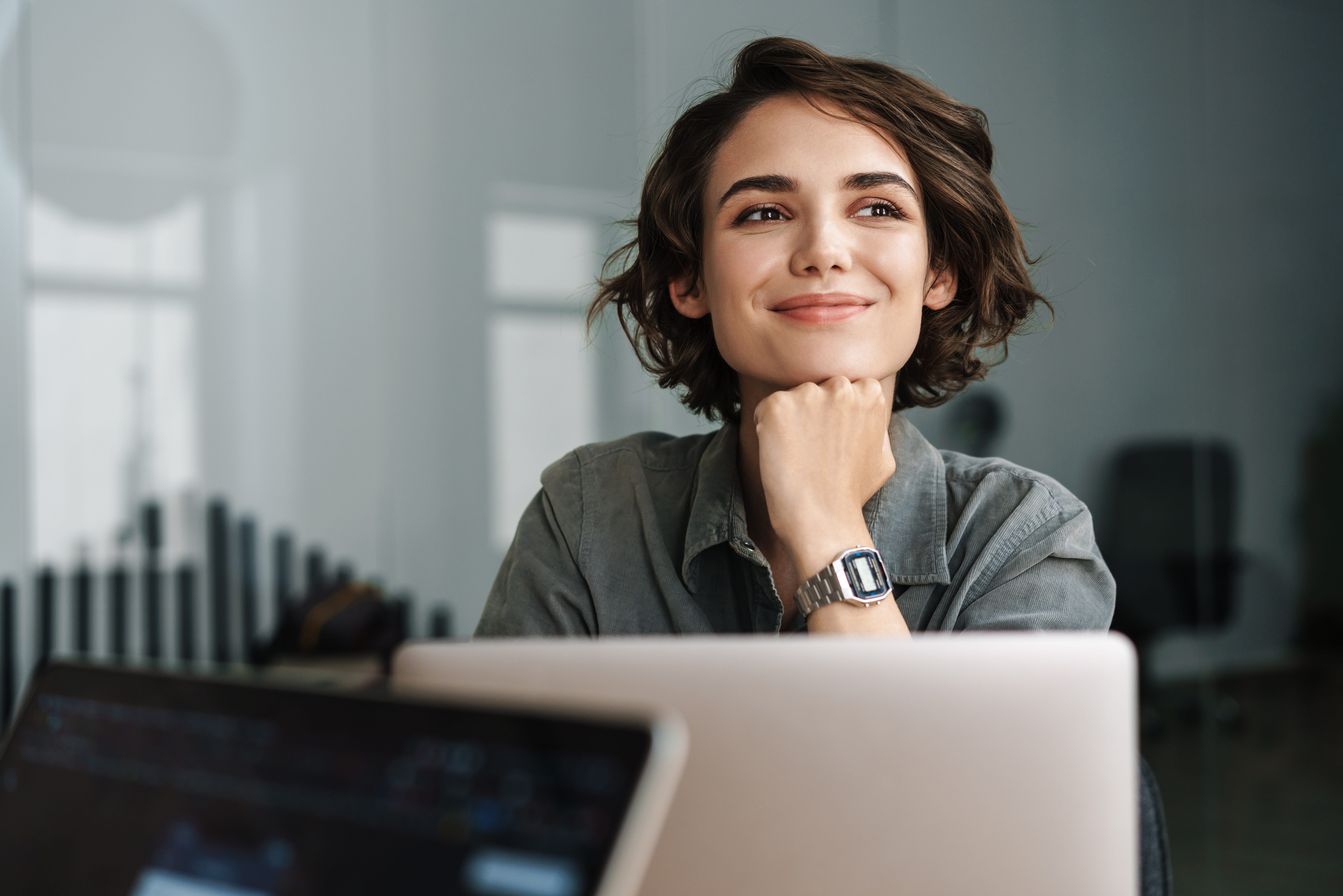 Woman who just started a new job placed by Adecco looks forward to her next rewarding project at work.