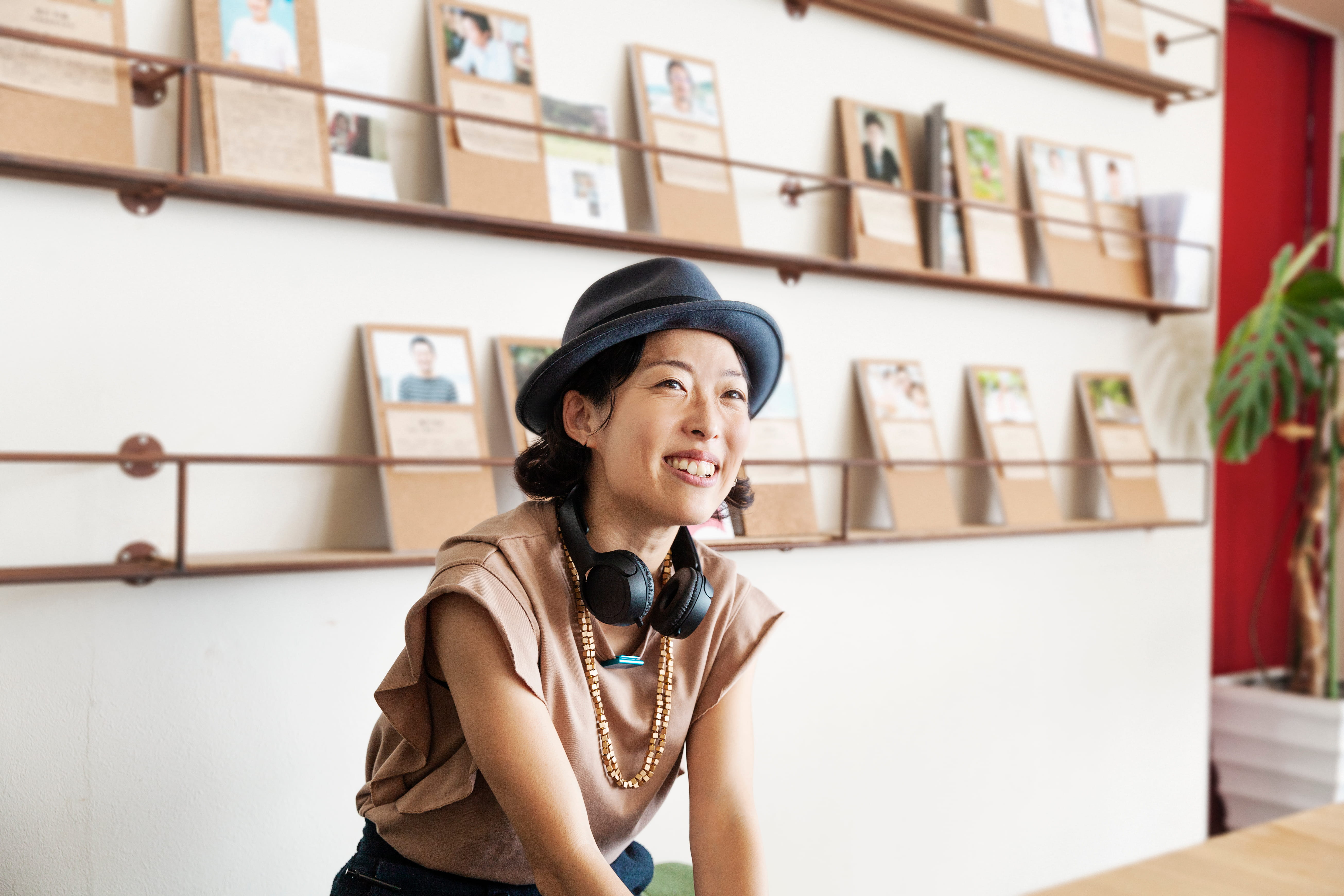 Woman looks forward to working with Adecco as she smiles at a recruiter.