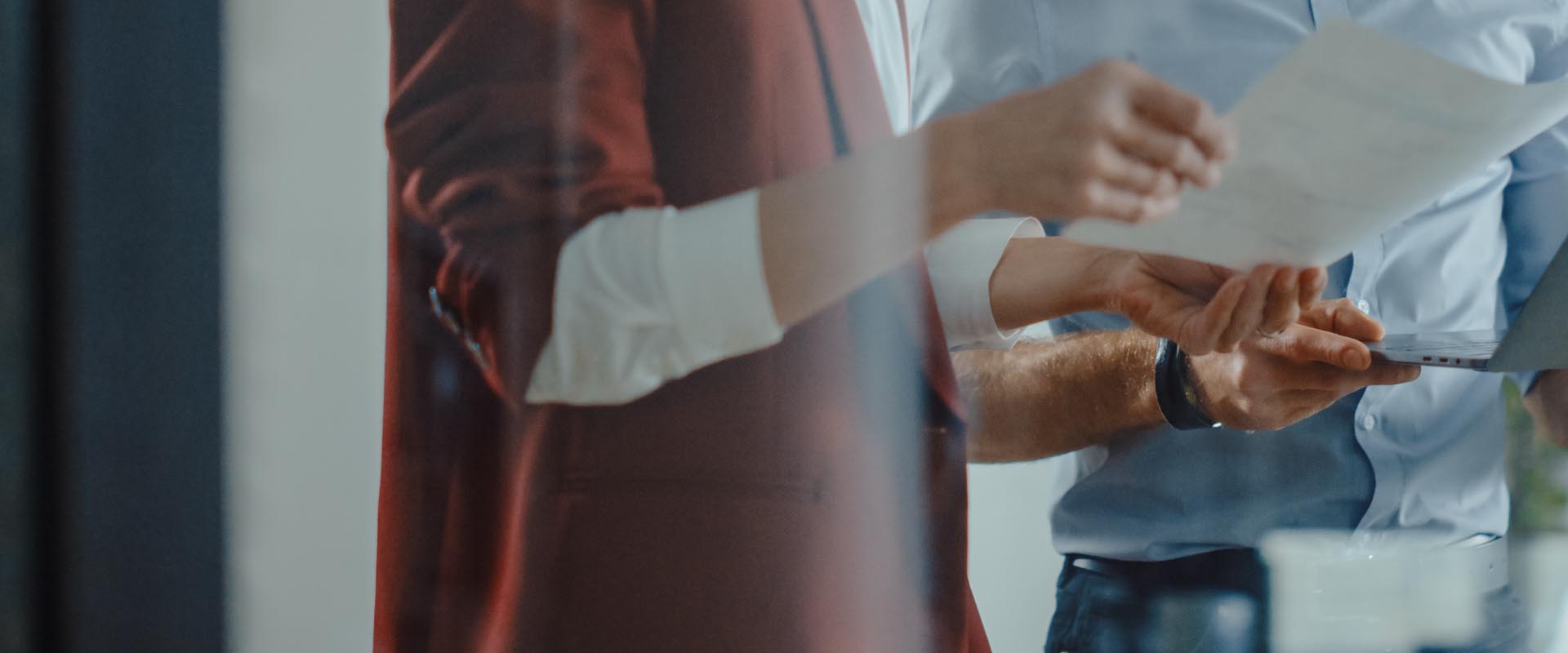 Business professionals  discussing strategy over a  document