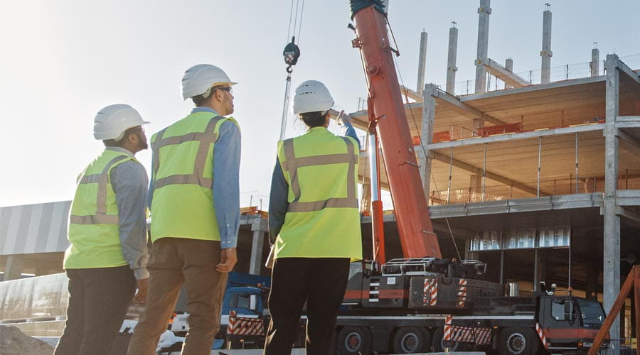 Construction project  managers discussing  tasks on-site