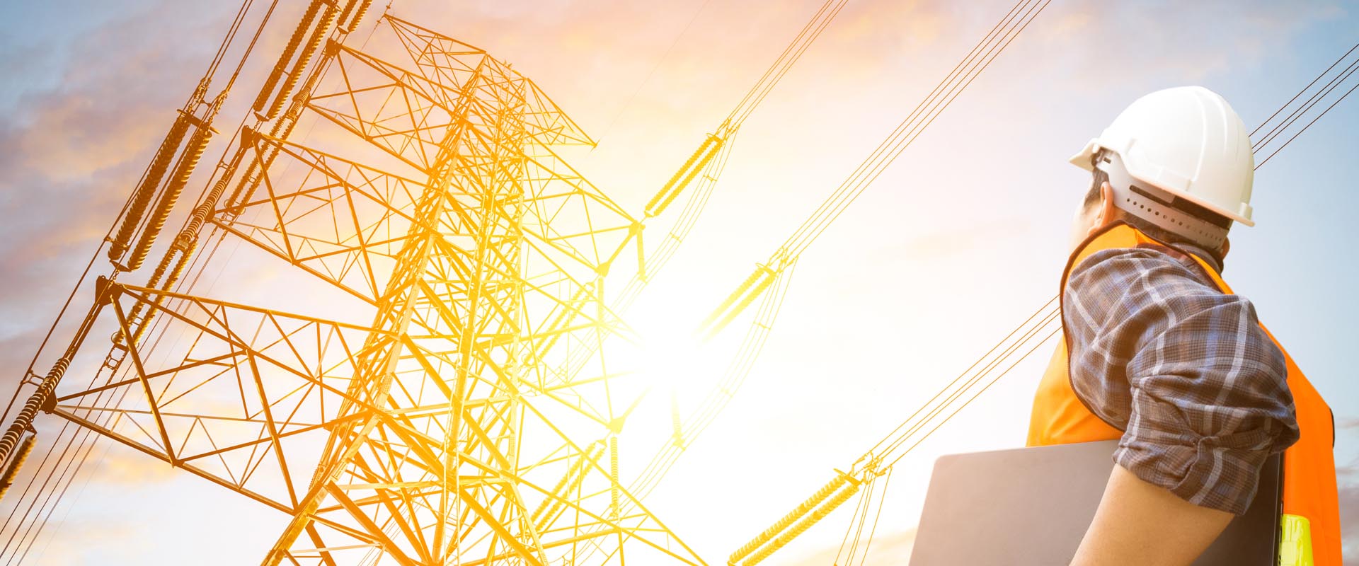 Utility workers inspecting  powerlines with safety  gear