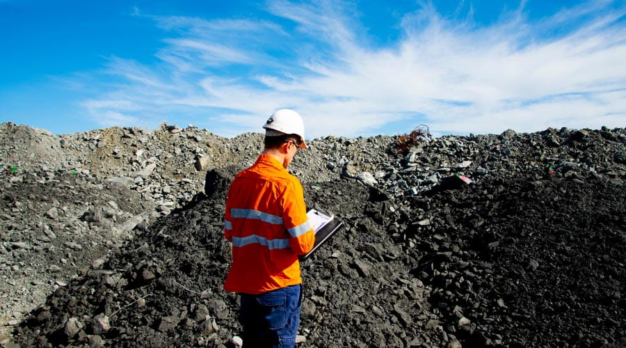 Mining engineer  inspecting a project site in  the field