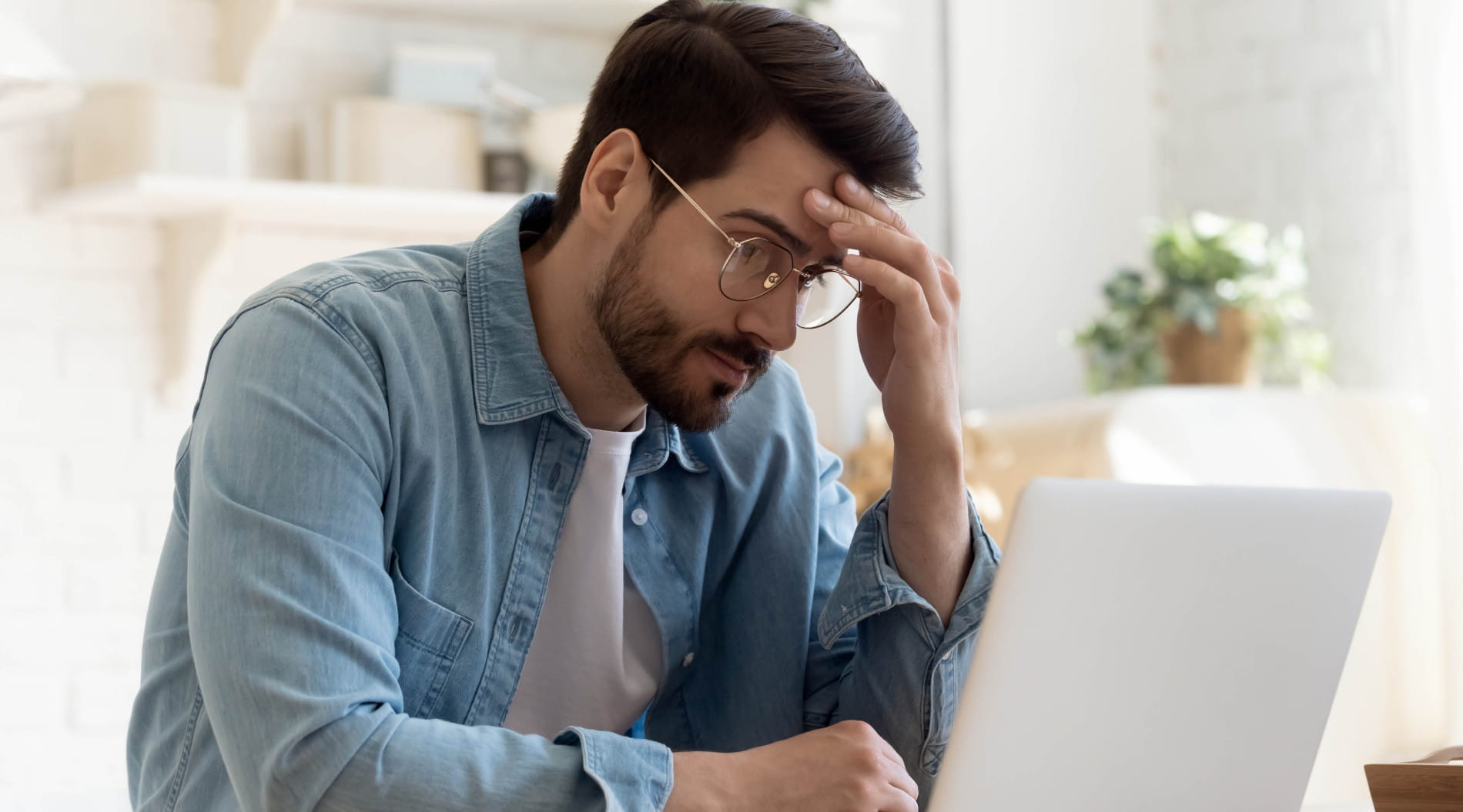 Person working on a laptop in a home office