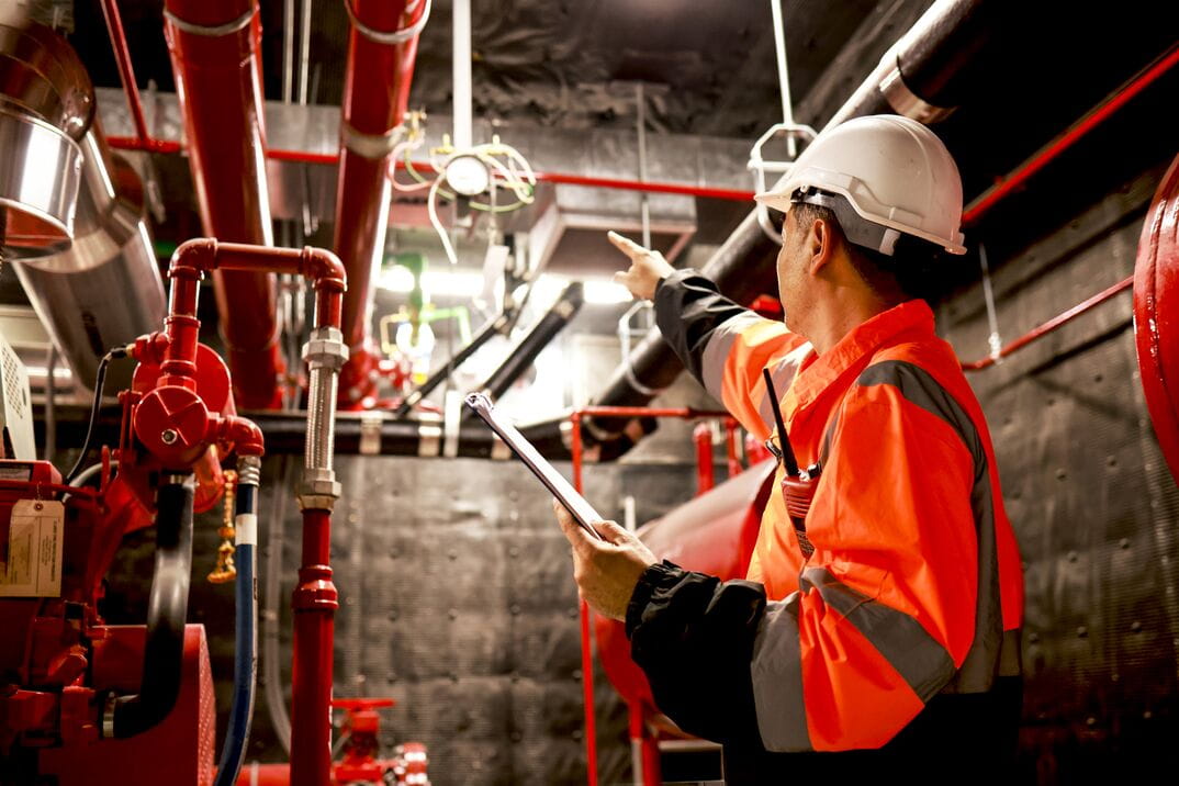 Person in a hard hat and safety jacket