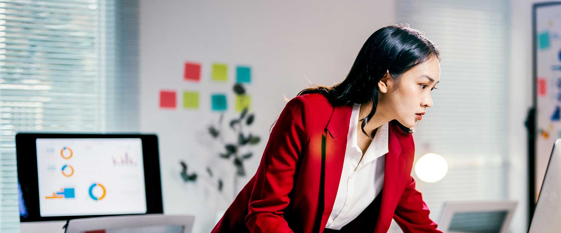 Smiling professional in corporate finance environment