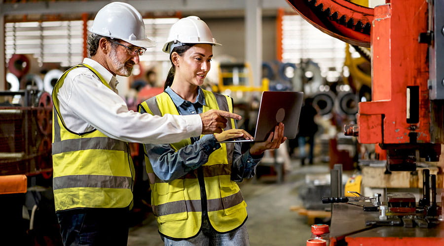 Workers collaborating on manufacturing process