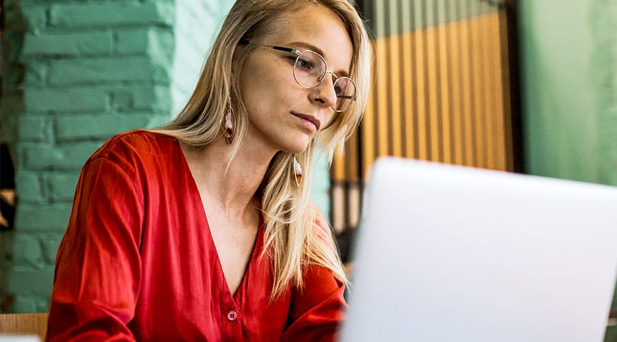 Woman working on laptop in office