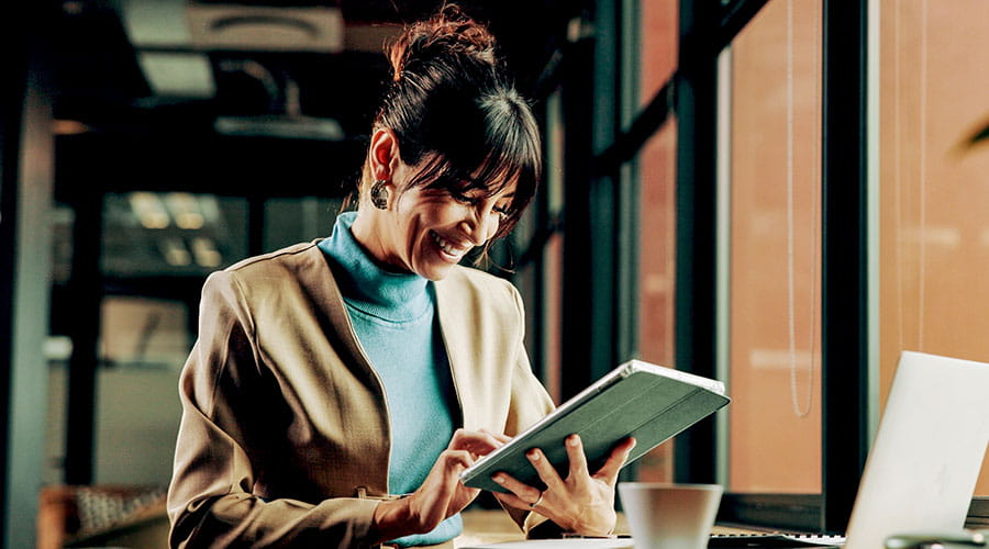 Person using tablet in workspace Person using tablet in workspace