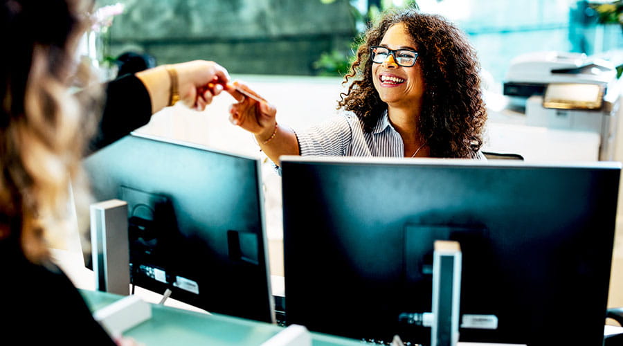 Colleagues working at computers in office