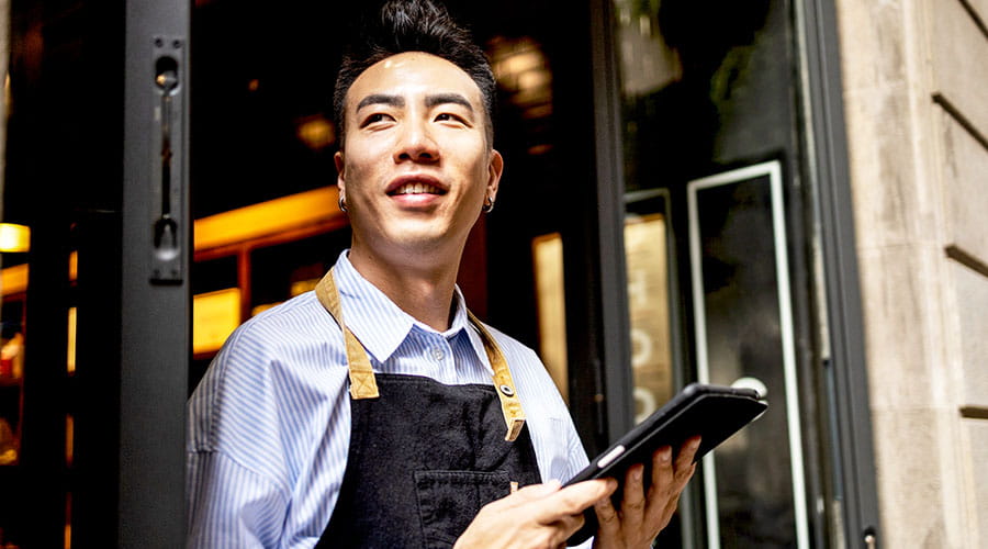 Retail worker using tablet in store
