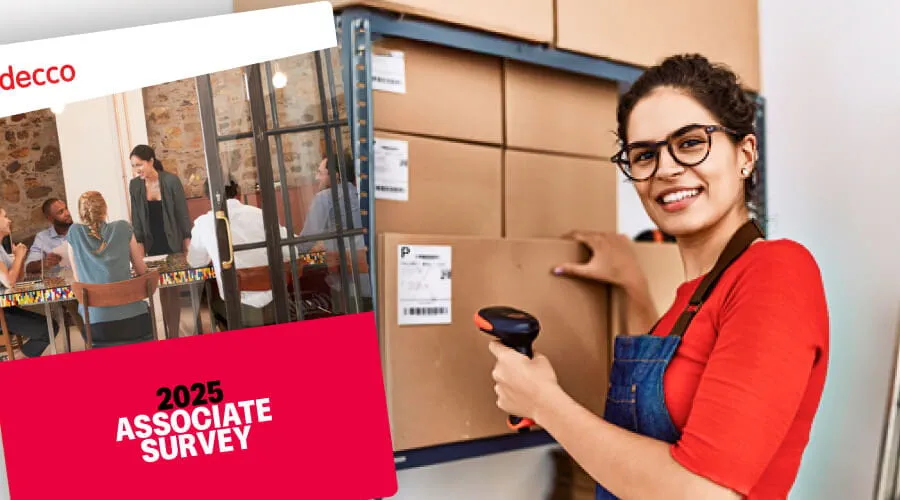 Person in a warehouse holding a barcode scanner with a red banner reading 2025 Associate Survey. Person in a warehouse holding a barcode scanner with a red banner reading 2025 Associate Survey.