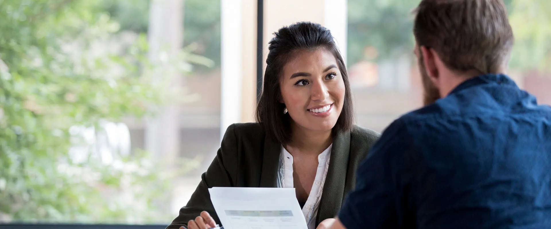 Smiling professional conducting interview. Smiling professional conducting interview.