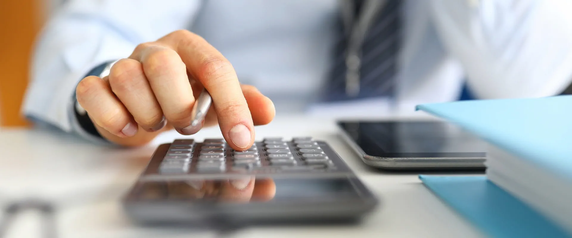 hand using calculator hand using calculator