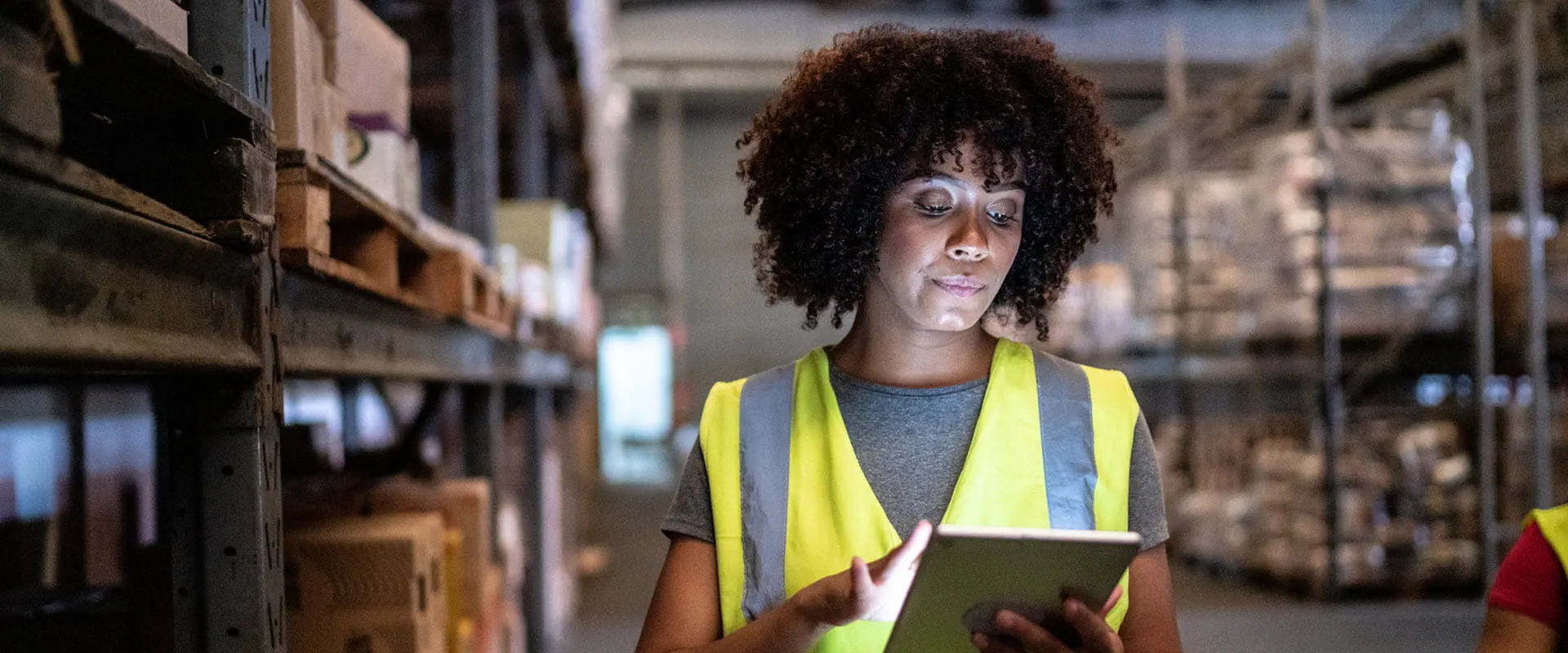 Young worker using the digital tablet in a warehouse Young worker using the digital tablet in a warehouse
