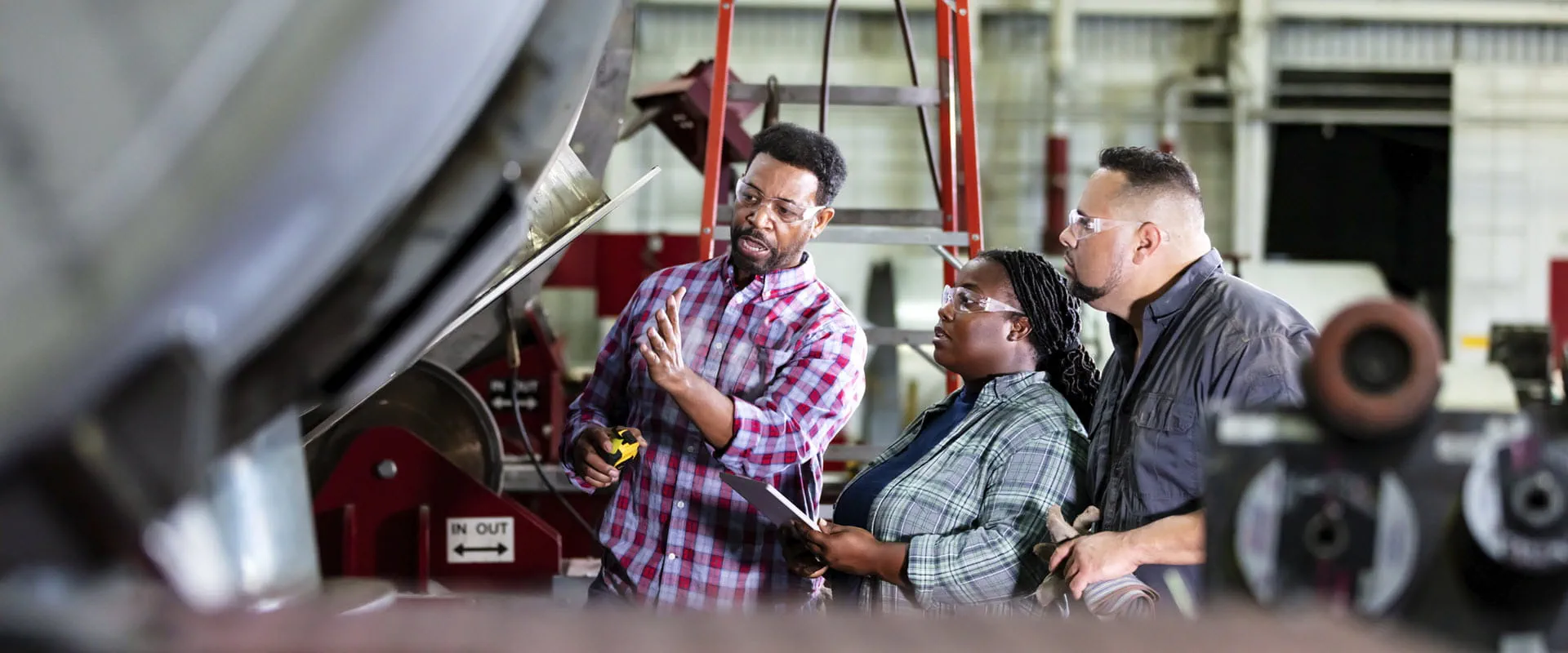 One older worker trains two younger workers One older worker trains two younger workers