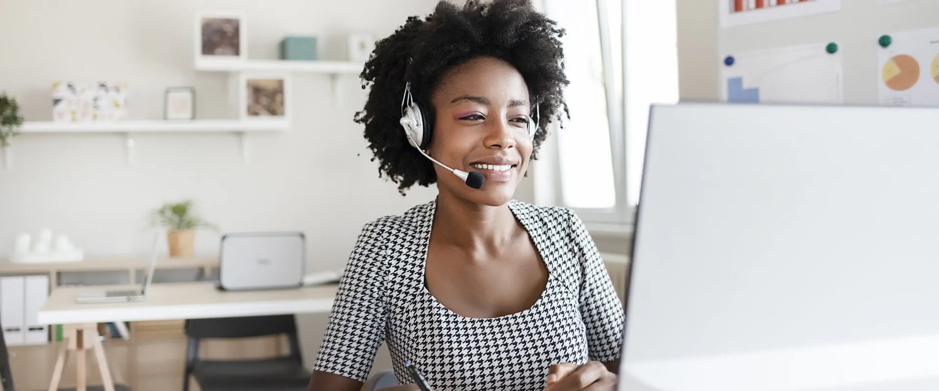 Customer support person wearing headset working from home. Customer support person wearing headset working from home.