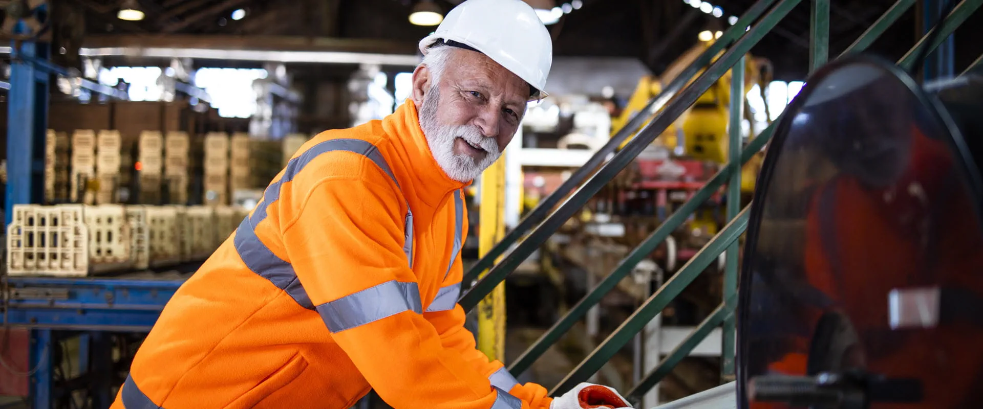 Factory worker operating industrial machine Factory worker operating industrial machine