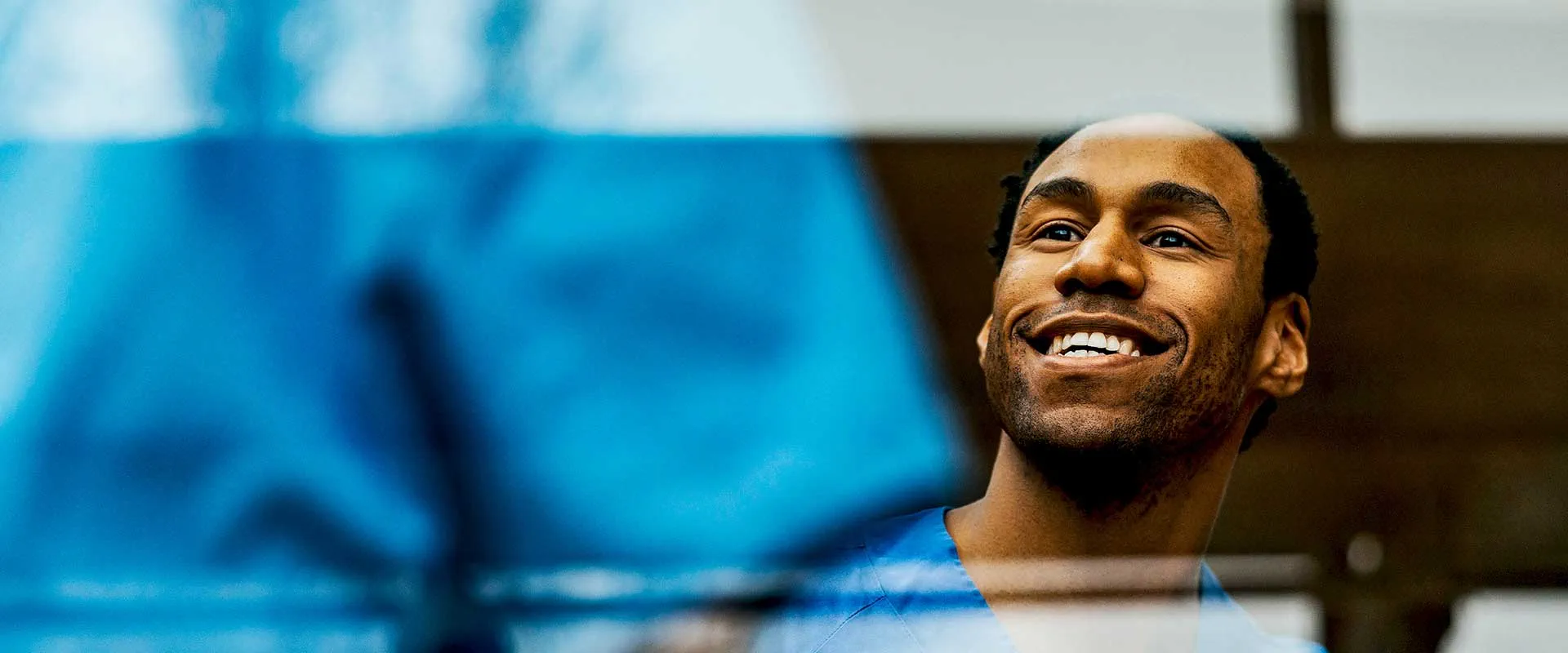 Healthcare professional smiling in hospital environment
