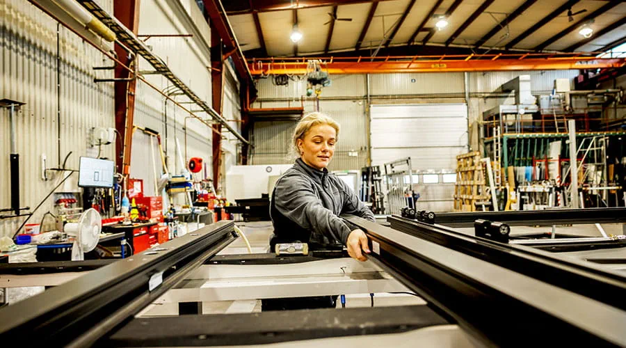  Production line with worker operating machinery