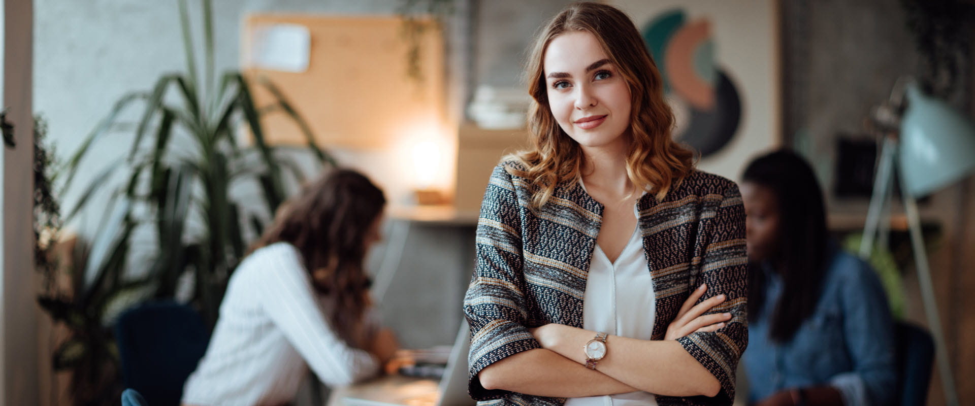 Confidant business person, leaning on table, looking at camera. Confidant business person, leaning on table, looking at camera.