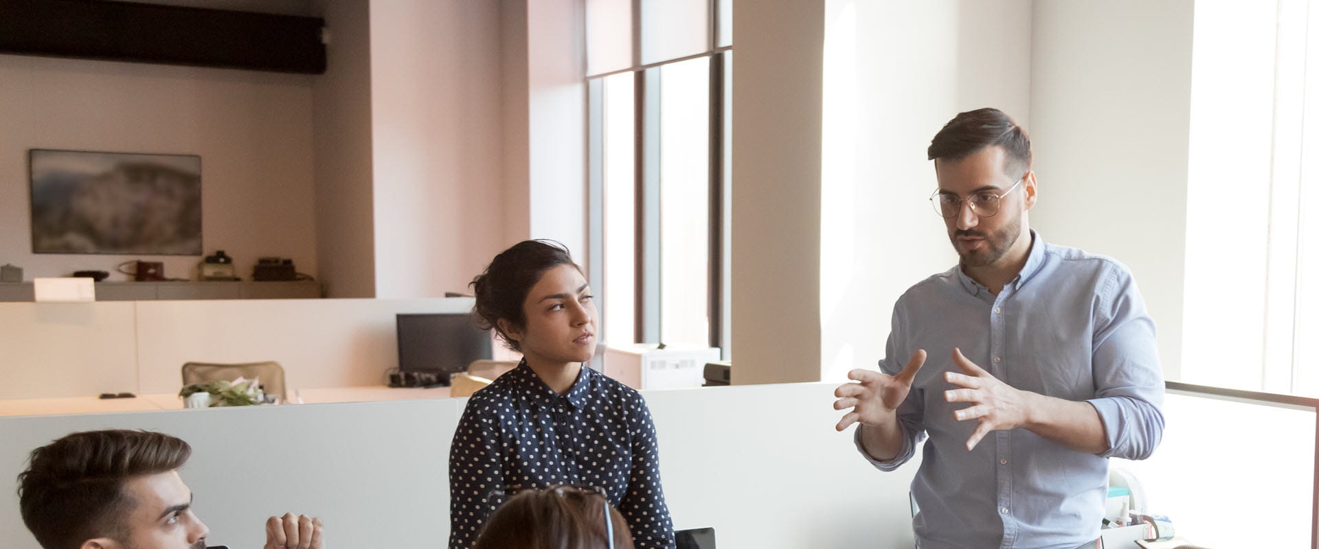 man speaking to group in conference room man speaking to group in conference room