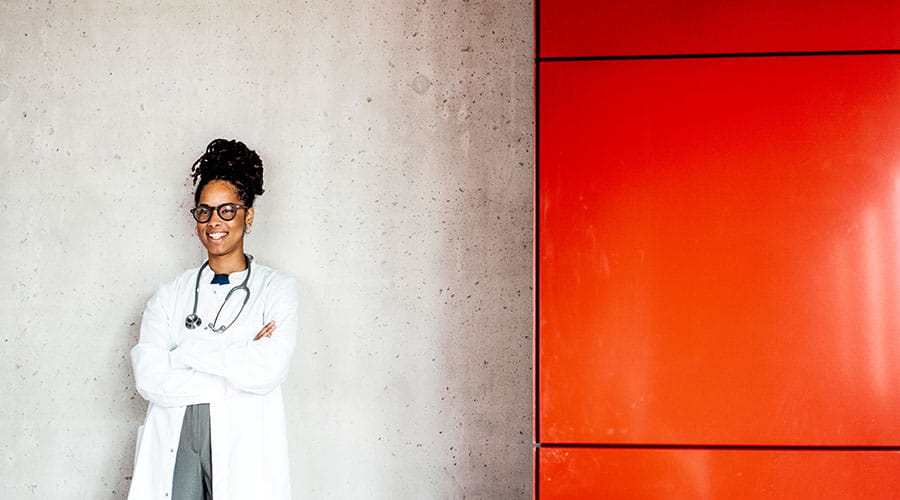 Doctor standing with arms crossed Doctor standing with arms crossed
